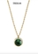 Collana inossidabile dei gioielli di coppia di torsione dell'oro della collana del pendente della pietra del giro di verde dell'OEM