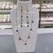Collana lunga e orecchino con simbolo magico in oro 14k su gioielli in acciaio inossidabile